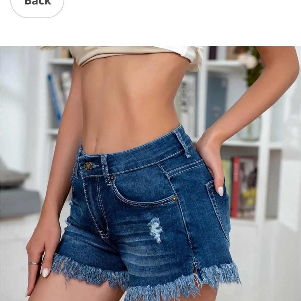 Amazon’s Modarani Small distressed, ripped, raw hem mid rise NWOT denim shorts.